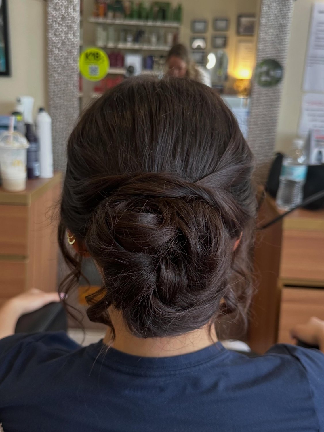 Sleek low chignon updo by Spalon stylists in Hudson NY
